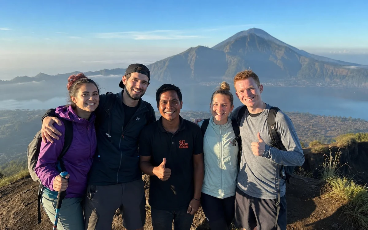 A 4WD parked on the rim above Lake Batur with the caldera opening out behind it