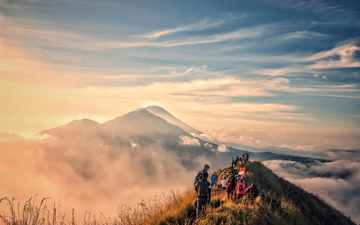 First light over the crater of Mount Batur with the highlands below